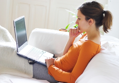Bonnie checks messages on her laptop.