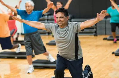 man exercising in a group