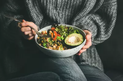 woman holding a salad