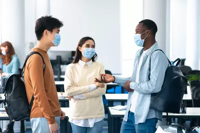 people talking with masks on