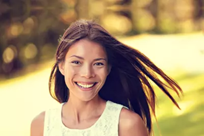 person outdoors smiling