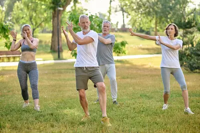 older people doing qigong in a park