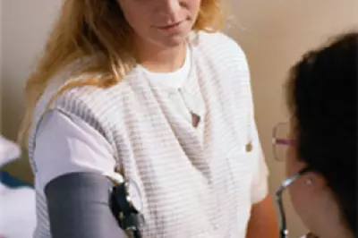 Young female patient gets her blood pressure checked