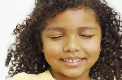 close up of child's face with eyes closed